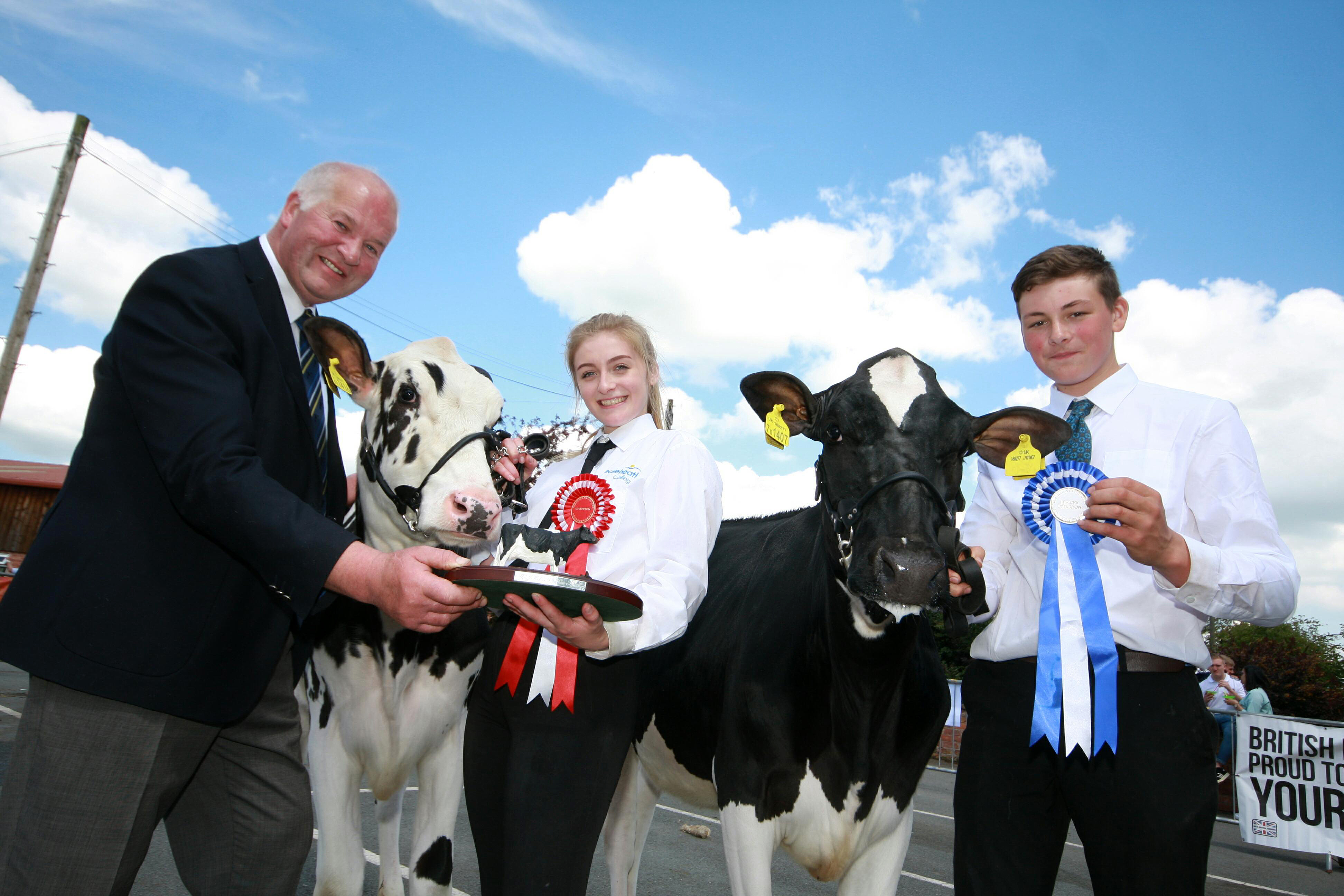 Calf show champions Molly Johnson and Marcus Callwood, judge Ray Brown ...